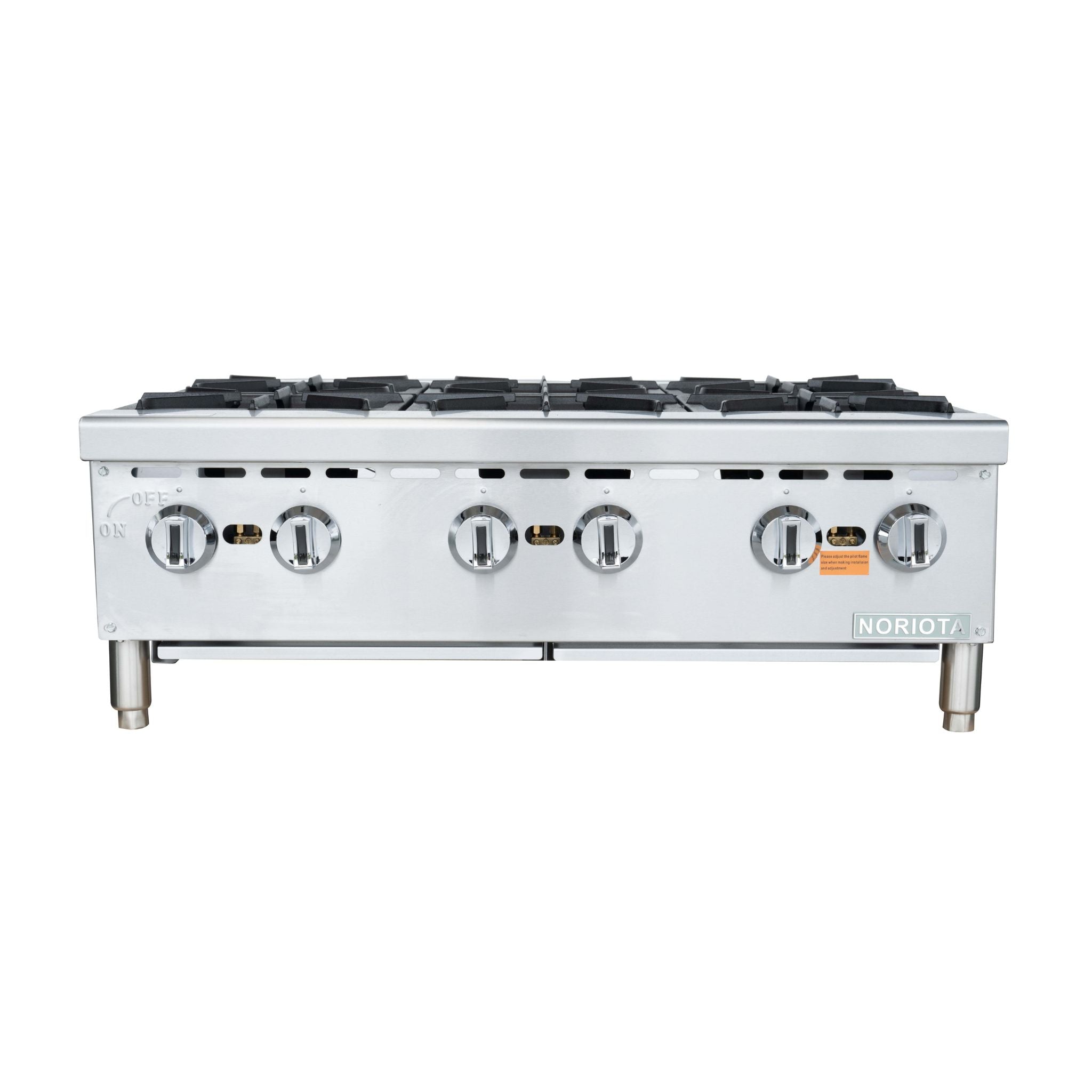 A commercial 6-burner gas hot  plate with a stainless steel body, four front control knobs, and silver legs, shown against a plain white background.