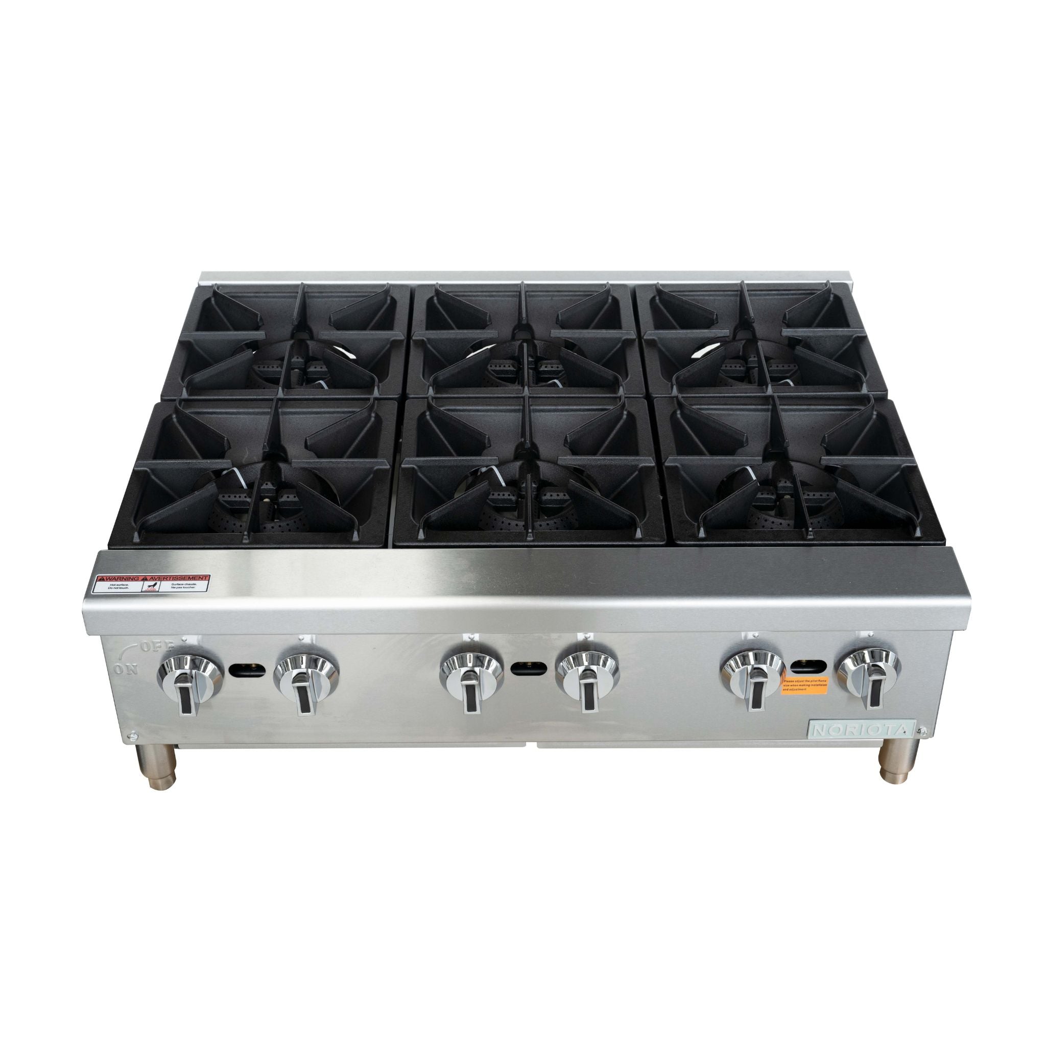 Commercial gas hot plate with a stainless steel body, black cast iron grates, and six front control knobs, shown against a plain white background.