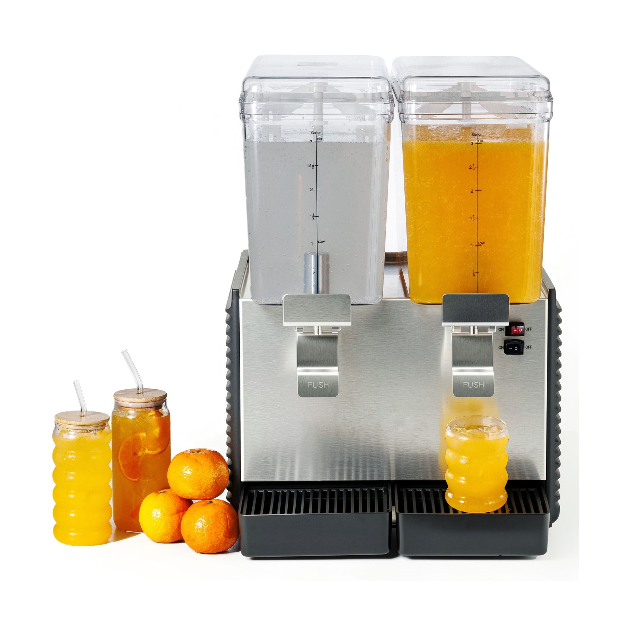 A stainless steel dual dispenser beverage machine with two clear drink containers, one filled with orange juice and one empty, shown on a white background with two glass jars of orange drink and three oranges beside it.