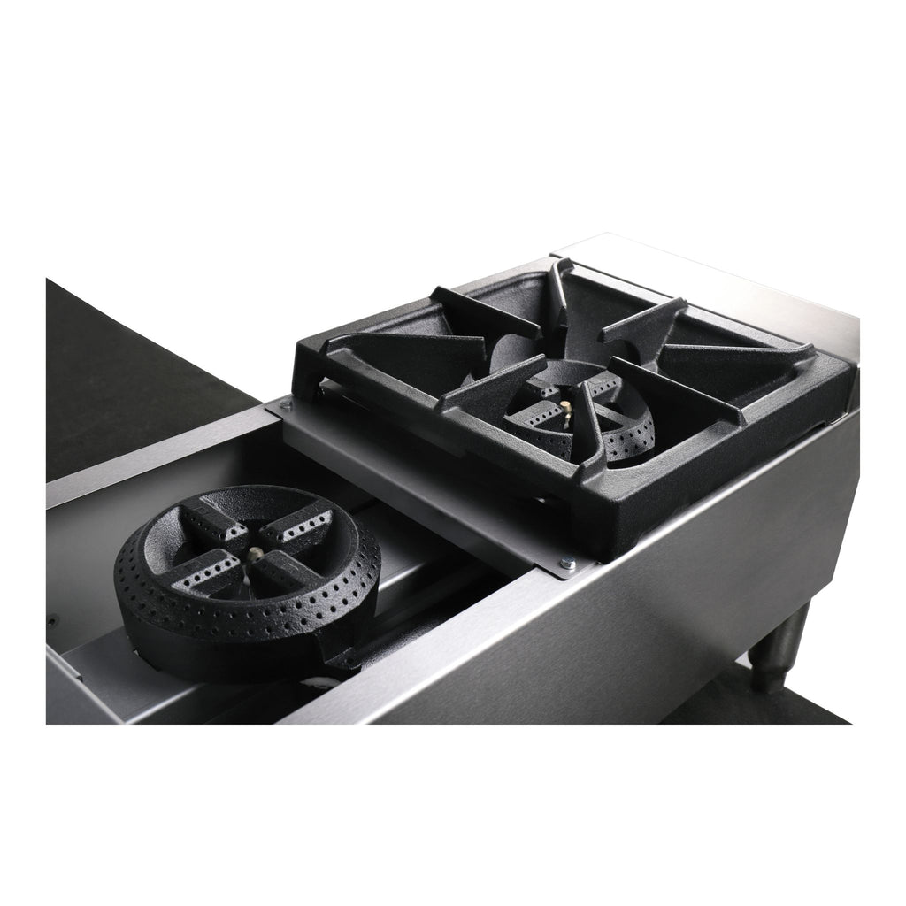 Close up detail of the gas cast iron burners black gas stove with four burners on a white background