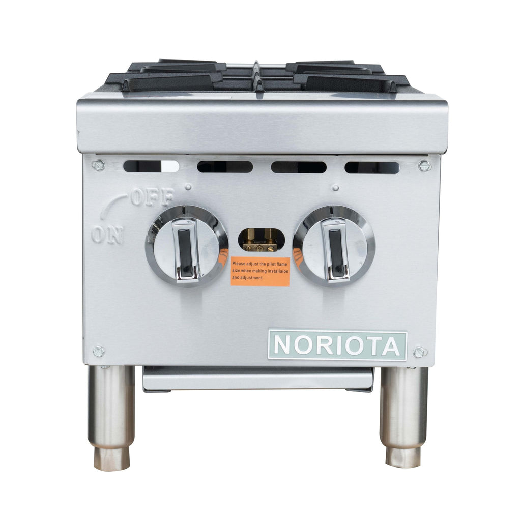 A stainless steel gas hot plate with two front control knobs, black grate burners on top, and a visible NORIOTA brand plate on the front.