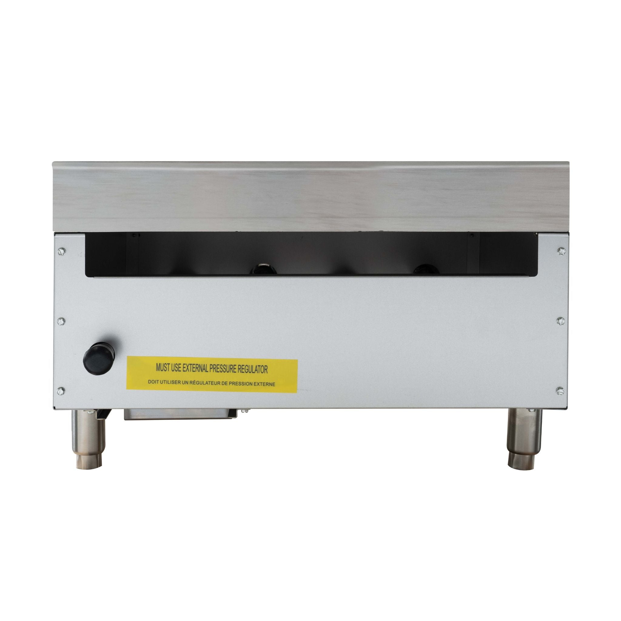A stainless steel commercial appliance, manual griddle shown from the back with a yellow warning label and a black vent slot.