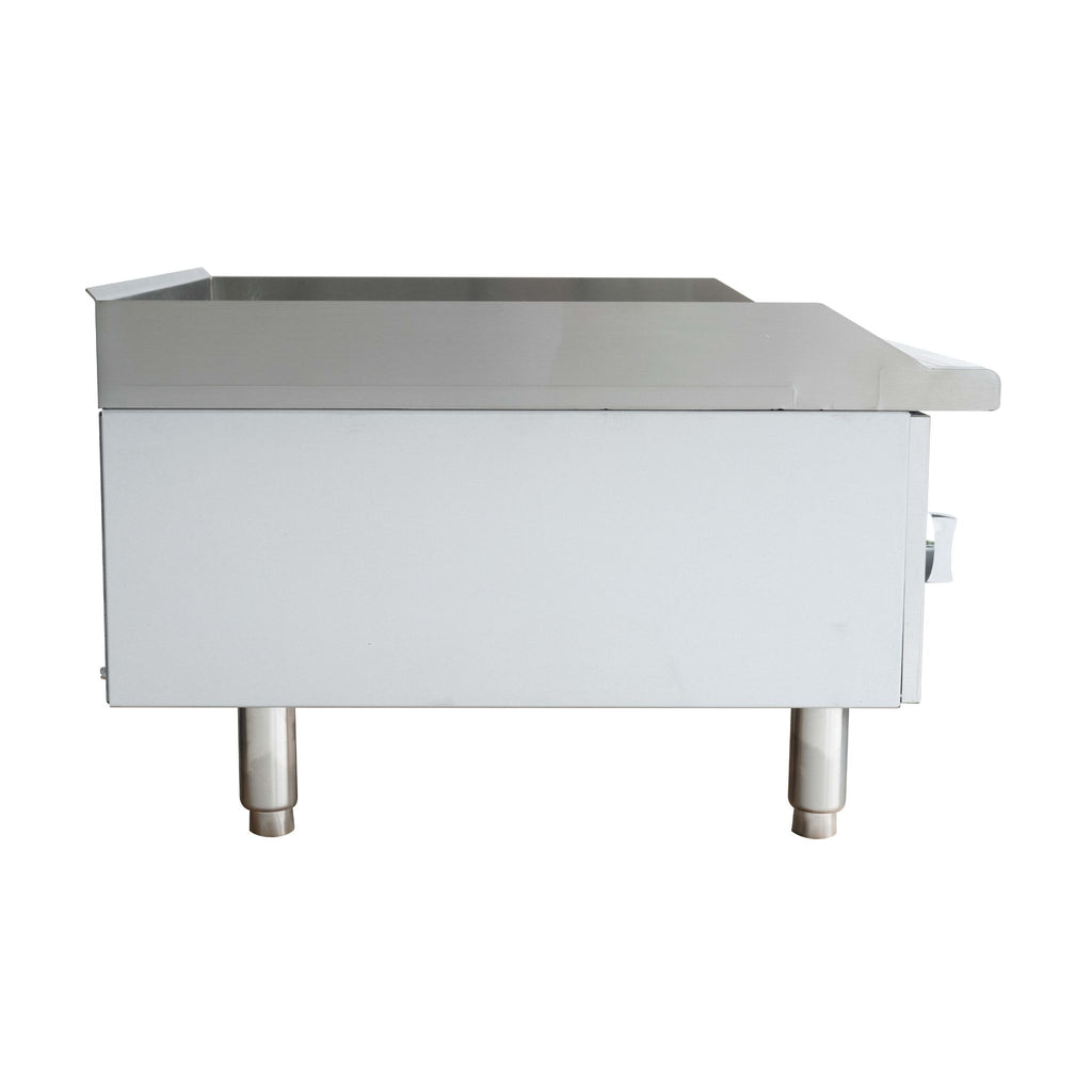 A commercial stainless steel counter top unit or a manual griddle with a flat top surface, side panel, and two legs, shown from a side angle on a white background.
