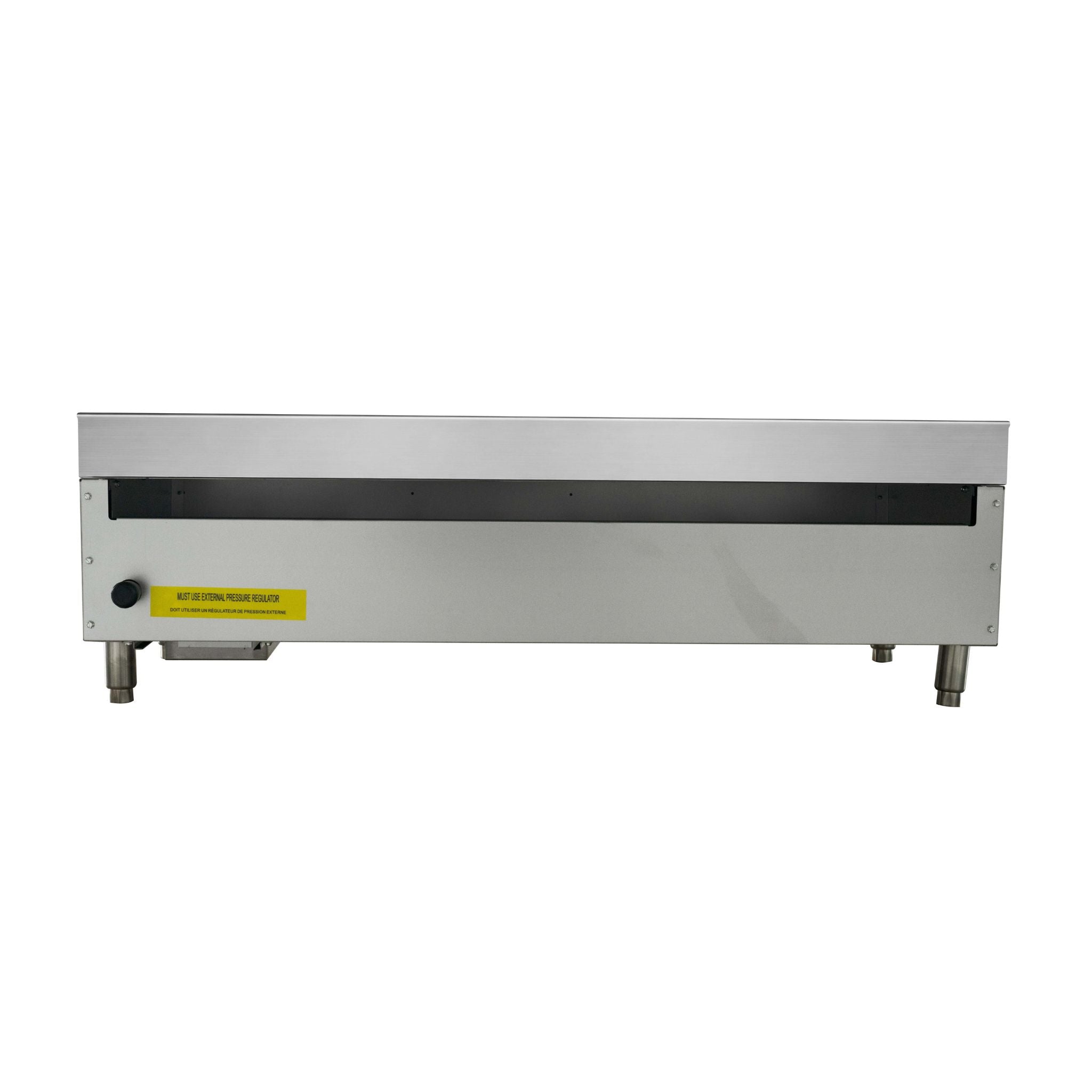 A stainless steel commercial countertop appliance, manual gas griddle or flat top, with a black horizontal slot on top, metal legs, and a yellow warning label on the front.