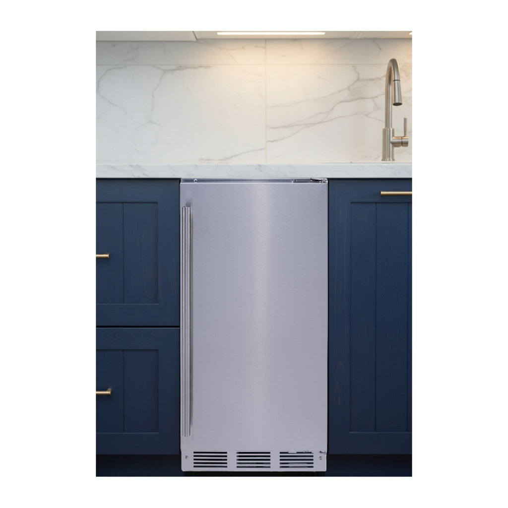 noriota NUI15GOPSS stainless steel gourmet ice machine in a kitchen with blue cabinets and white marble backsplash.